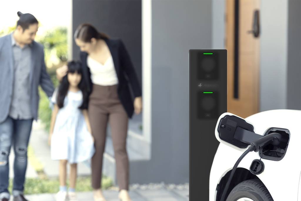 focus-home-charging-station-ev-car-blur-progressive-family-background